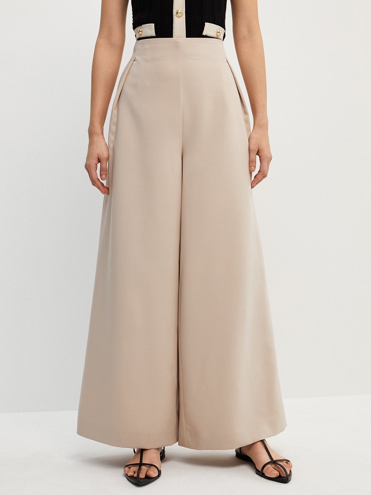Pleated flared trousers on sale